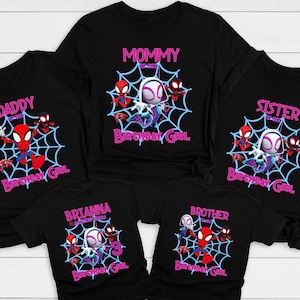 May include: Black t-shirts with a Spider-Man theme. The shirts feature a white spider-woman character with red spider-man characters. The shirts say "Mommy of the Birthday Girl", "Daddy of the Birthday Girl", "Sister of the Birthday Girl", "Brother of the Birthday Girl", and "Brianna of the Birthday Girl".