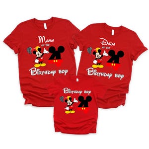 May include: Three red t-shirts featuring a graphic of Mickey Mouse, a large black number 4, and text. Two shirts read Mama of the Birthday Boy and Dada of the Birthday Boy, while the smaller shirt reads Birthday Boy in white lettering.