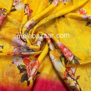 May include: Yellow linen fabric with a floral print. The fabric has a gradient effect, fading from yellow to pink at the bottom. The text "melabazar.com" is printed on the fabric.