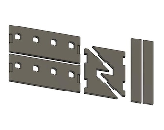 Könnte beinhalten: Ein Set aus flachen, grauen, lasergeschnittenen Bauteilen zur Montage, bestehend aus zwei rechteckigen Platten mit je vier bogenförmigen Ausschnitten, einer quadratischen Platte mit einem Zickzack-Schlitz und zwei schmalen rechteckigen Streifen.