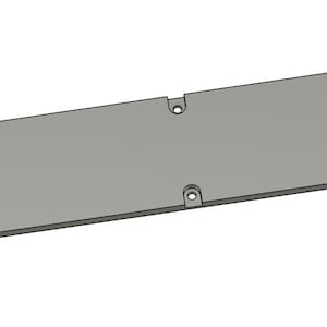 Puede incluir: Una placa de metal gris con bordes redondeados y varios agujeros pequeños.