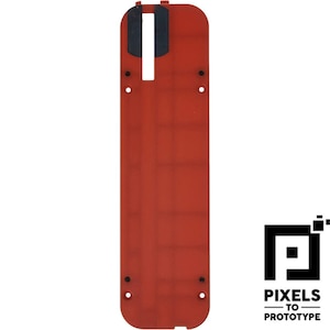 May include: A rectangular red table saw throat plate featuring a long central slot with two black inserts at the top, four small circular screw holes along the sides, and rounded corners at the bottom edge, presented on a plain white background.