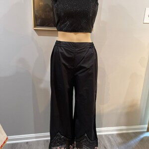 Black solid embroidered palazzos pants