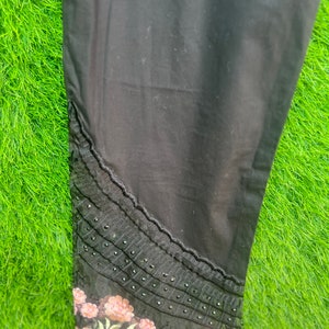 Black solid embroidered palazzos pants
