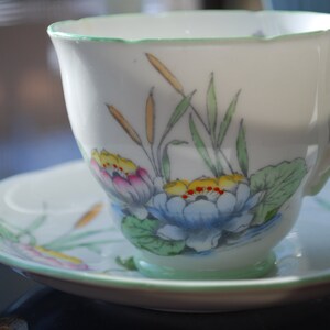 Sutherland English and Royal Stafford Bone China Teacup with matching Peach Blossoms pattern.