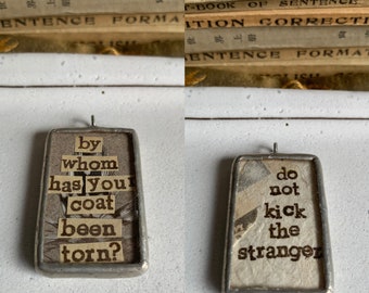 Pondant: do not kick the stranger; by whom has your coat been torn? glass pendant