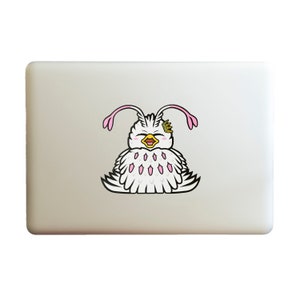 May include: A white laptop with a sticker of a cartoon bird with pink antennas and a crown on its head. The bird is smiling and has a white and pink fluffy body.