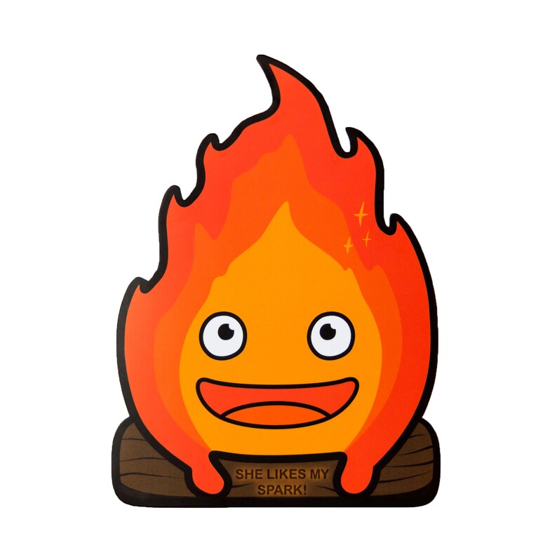 May include: A cartoon fire spirit with a smiling face and large eyes. The fire spirit is orange and red and has a small log underneath it. The text "SHE LIKES MY SPARK!" is written below the fire spirit.