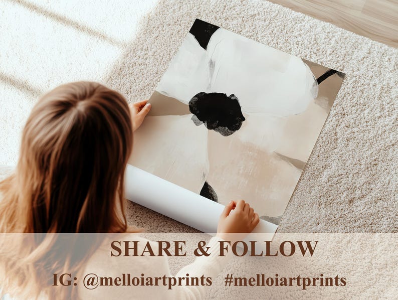 May include: An abstract art print featuring a large black and white floral design on a neutral background. The print is being held by a person, with a rolled-up print visible below. The text "SHARE & FOLLOW" and Instagram handle are at the bottom.