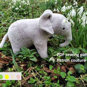 May include: A grey plush elephant toy with a long trunk, standing in a bed of green plants and white snowdrop flowers. The text "PDF sewing pattern" and "Patron couture PDF" is visible below the elephant. A difficulty chart with four coloured circles is visible in the bottom left corner.