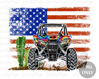 May include: A red, white, and blue American flag with a distressed look. A tie-dye patterned off-road vehicle is in front of the flag. The vehicle has large black tires and a black roll cage. The vehicle is on a dirt road.