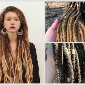 May include: A set of long, brown and blonde synthetic dreadlocks with gold metal beads. The dreadlocks are hanging from a hand and are in a natural setting.