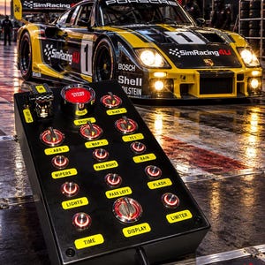 May include: A black rectangular sim racing button box featuring a large red engine start button, multiple toggle switches, and illuminated push buttons labeled with functions including ABS, MAP, TC1, WIPERS, PASS RIGHT, RAIN, LIGHTS, PASS LEFT, FLASH, TIME, DISPLAY, and LIMITER.
