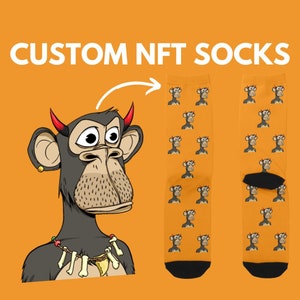 May include: A pair of orange socks with a repeating pattern of cartoon monkeys. The monkeys have red horns and are wearing a necklace of bones. The text "CUSTOM NFT SOCKS" is at the top of the image.