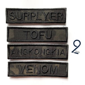 May include: Four black embroidered patches with different names on them. The patches are on a white background. The names on the patches are "SURPLYER", "TOFU", "ANGKONGKIA", and "VENOM".
