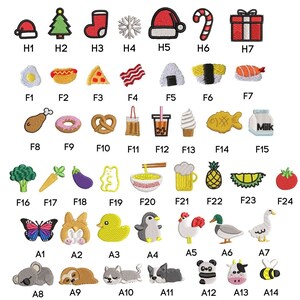 May include: A set of 24 colorful embroidered iron-on patches featuring various holiday, food, and animal designs. The patches are labeled with letters and numbers for easy identification.