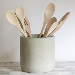 handmade concrete 6" utensil holder crocThis striking vessel is for anyone who appreciates the naturally bold aesthetic of concrete.