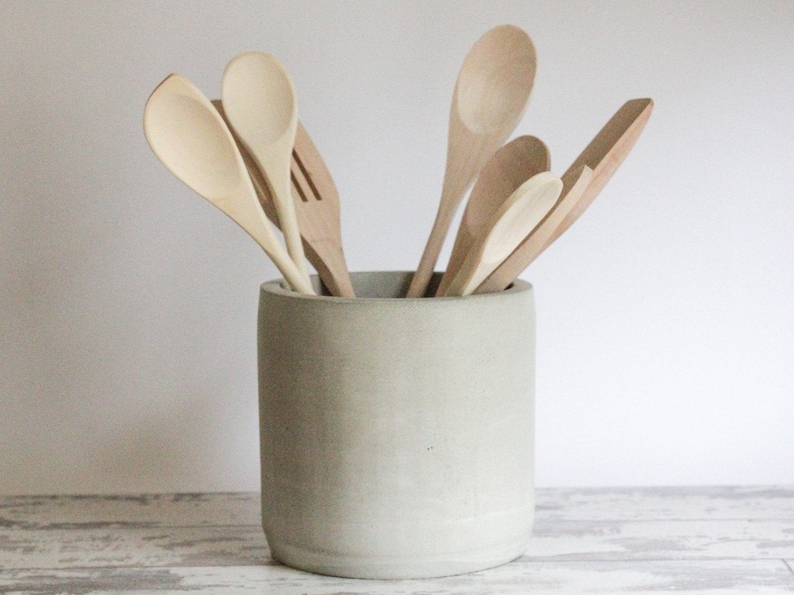 handmade concrete 6" utensil holder crocThis striking vessel is for anyone who appreciates the naturally bold aesthetic of concrete.