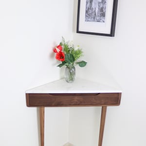 Corner console table in Walnut or Oak with Marble top.
