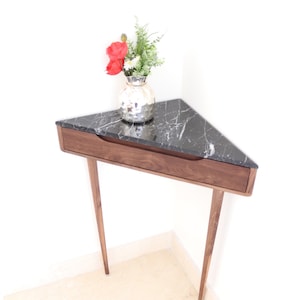 Corner console table in Walnut or Oak with Marble top.