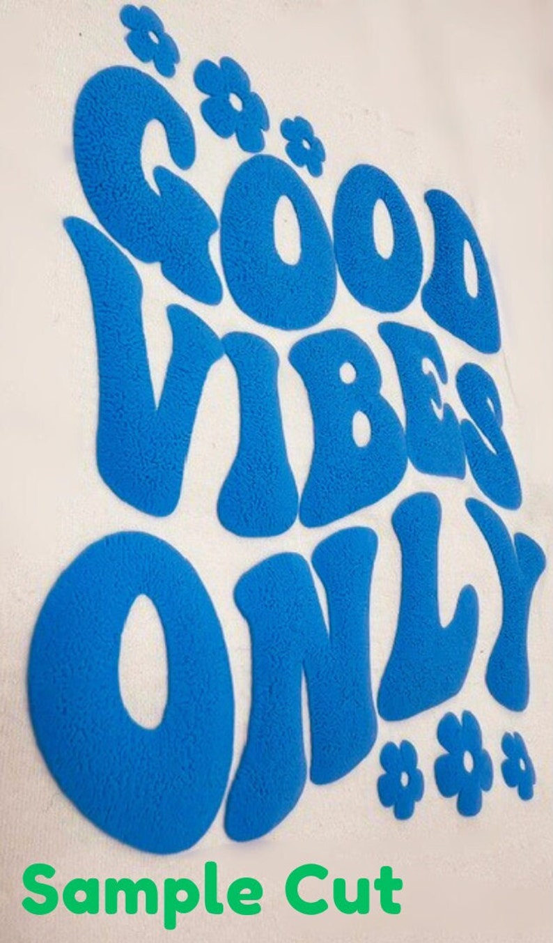 May include: A blue, fuzzy, vinyl-like sticker with the text "Good Vibes Only" in a retro font. The sticker is surrounded by small, blue, fuzzy, flower shapes.