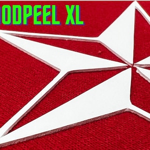 May include: A white, five-pointed star with a textured surface, against a red background. The star is made of a thick material and has a slightly raised edge. The text "GOODPEEL XL" is visible in green letters at the top of the image.