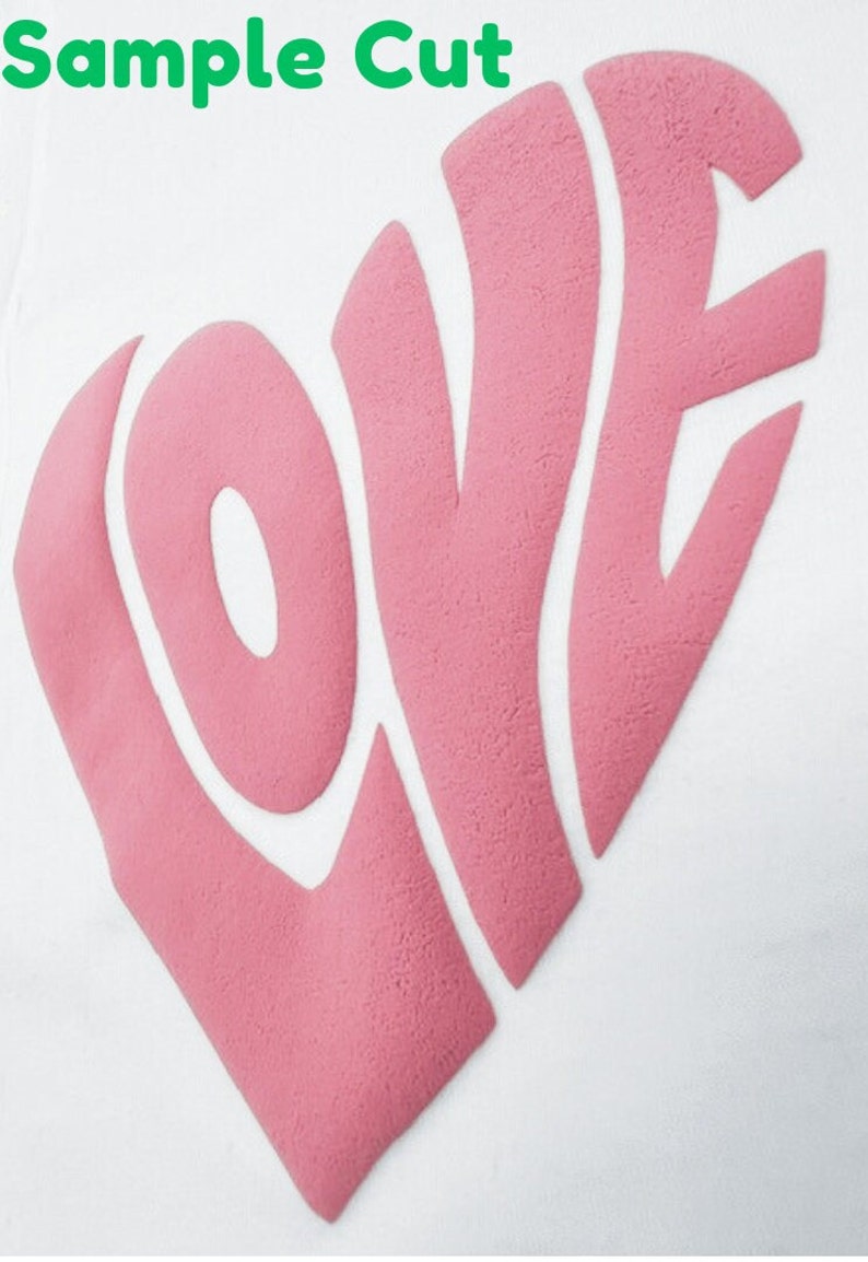 May include: A pink "LOVE" design cut out of a heart shape. The design is on a white background.