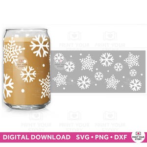 May include: A clear glass can-shaped cup with a white snowflake design. The cup is filled with a light brown liquid. A gray rectangular graphic with white snowflakes is to the right of the cup. The text "DIGITAL DOWNLOAD SVG • PNG • DXF" is at the bottom.
