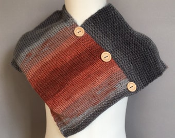 A Lovely Handmade Knitted Soft Baby Poncho in Great Autumn tones of Grey and Burnt Orange