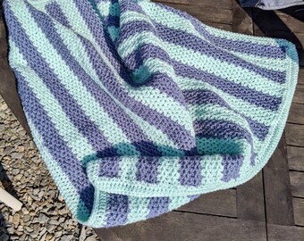 A beautiful soft, hand crotched baby blanket in Greyish Blue and Mint Green with a (V) pattern.