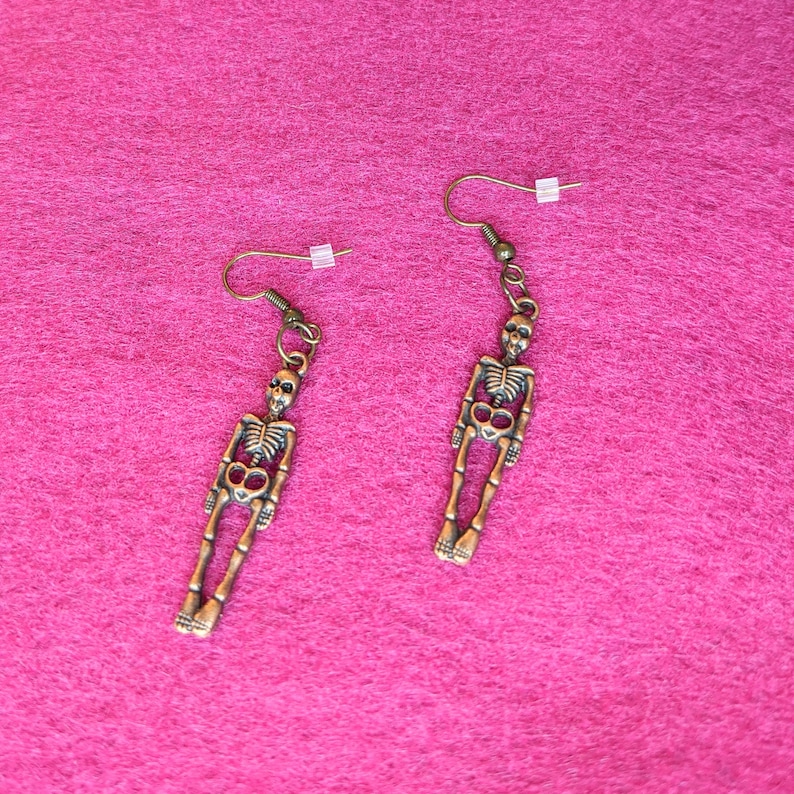 Earrings-dangling bronze colored skeletons