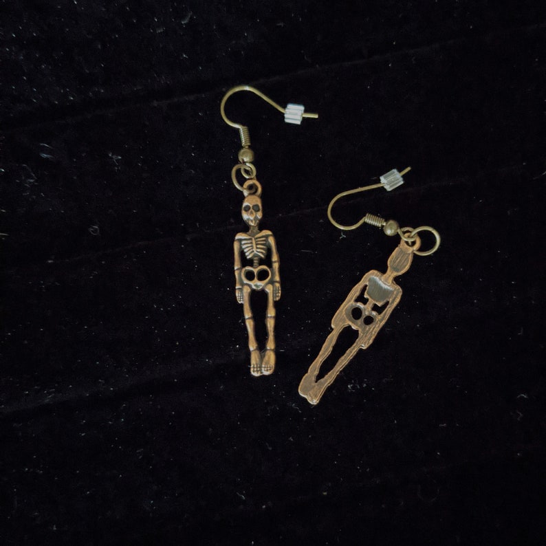 Earrings-dangling bronze colored skeletons