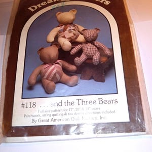 May include: A Dream Spinners #118 ... and the Three Bears sewing pattern package in a plastic sleeve. The cover features three stuffed fabric teddy bears with patchwork and plaid patterns, with text indicating full size patterns for 17, 20, and 24 inch bears.