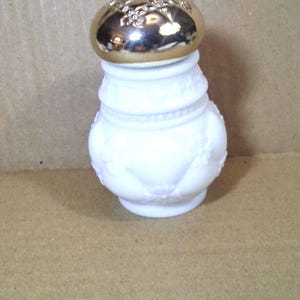 AVON Moonwind Sachet Powder, Milk Glass Bottle. This bottle is full.