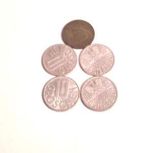 May include: Five German coins, four silver and one copper, on a white background. The silver coins feature the German eagle and the text "10 Groschen" and "1 Groschen".