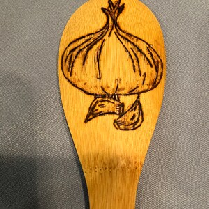 Bamboo cooking spoon with Woodburned design