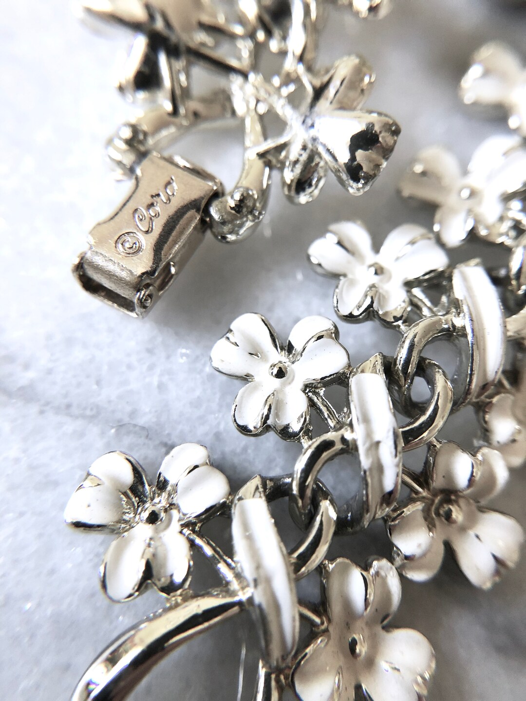 Vintage Signed CORO Costume Jewelry White Enamel Flower Ribbon Bracelet