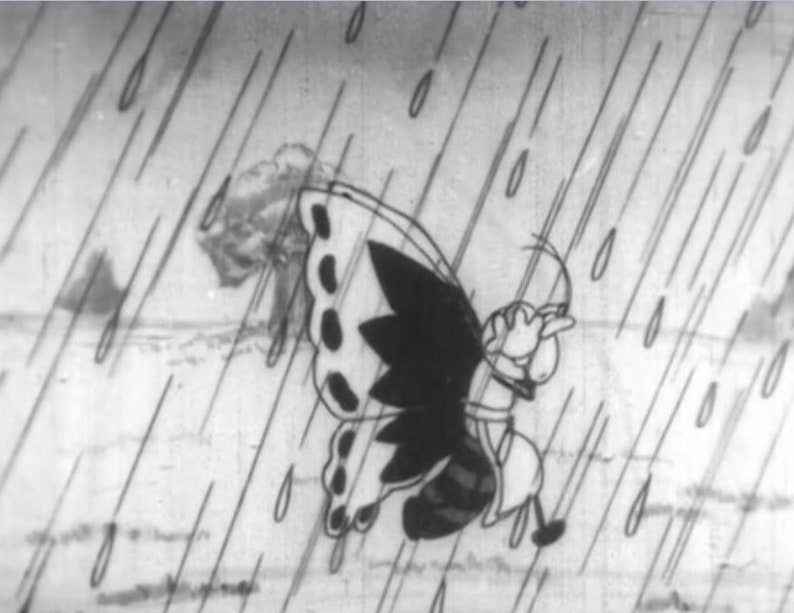 May include: A black and white cartoon illustration of a butterfly with a human-like face and body, flying in the rain.