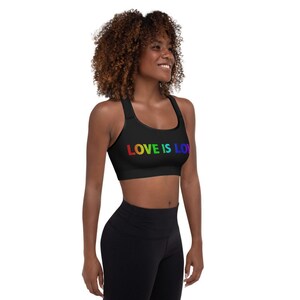 May include: A black sports bra with rainbow lettering that reads "LOVE IS LOVE".