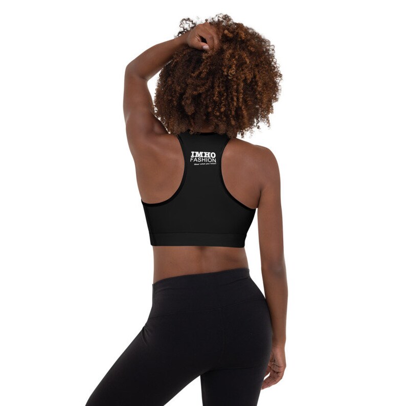 May include: Black sports bra with a white "IMHO FASHION" logo on the back.