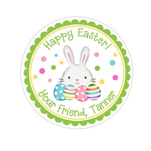 May include: A green and white round sticker with a white bunny rabbit holding colorful Easter eggs. The sticker says "Happy Easter! Your Friend, Tanner".