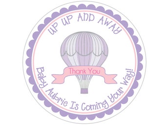May include: Purple and pink round sticker with a hot air balloon and the text "Up Up And Away Baby Aubrie Is Coming Your Way!" with a pink banner that says "Thank You".
