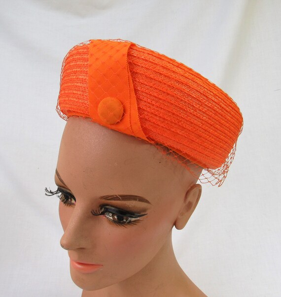 orange pillbox hat