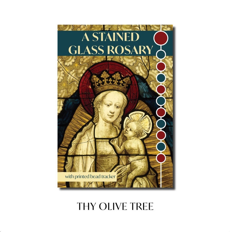 May include: A stained glass rosary with a depiction of the Virgin Mary and baby Jesus. The rosary beads are red and blue. The text "A STAINED GLASS ROSARY" and "with printed bead tracker" are printed on the image. The text "THY OLIVE TREE" is printed below the image.