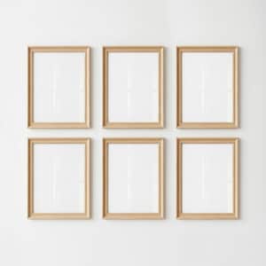May include: A set of six identical rectangular picture frames arranged in two rows of three. Each frame features a light-toned natural wood finish with a simple, clean profile and a white mat board surrounding a blank, white rectangular center space.