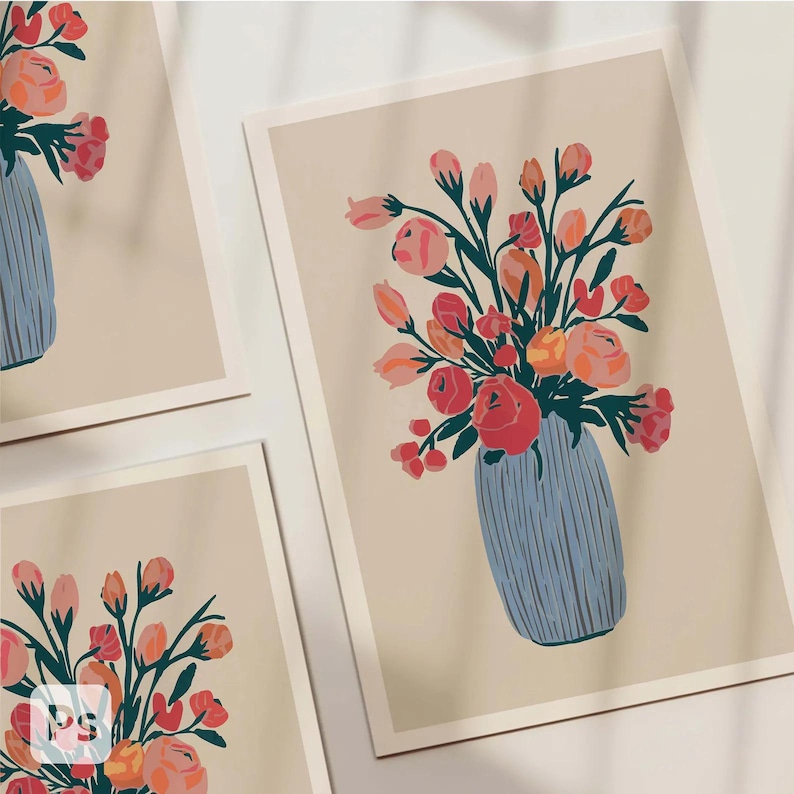 May include: Floral art prints featuring bouquets of pink, orange, and red flowers in blue vases. The artwork is set against a cream-colored background. The prints are displayed in a group, showcasing the floral arrangements.