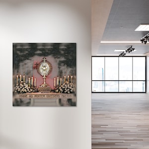 May include: A religious artwork depicting a golden monstrance with a radiant design, surrounded by lit candles and floral arrangements. The artwork includes the Latin inscription "USQUE AD MORTEM OBEDIENS FACTUS". The background has a textured, dark appearance.