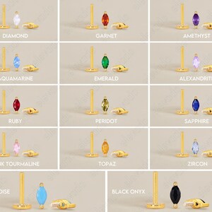 May include: A collection of gold-tone flat-back stud earrings featuring marquise-cut gemstones in various colors including diamond, garnet, amethyst, aquamarine, emerald, alexandrite, ruby, peridot, sapphire, pink tourmaline, topaz, zircon, turquoise, and black onyx.