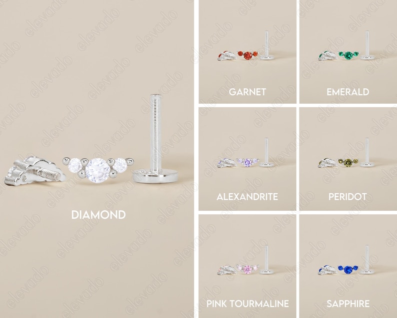 Op de afbeelding: Een set van 10 verschillende gekleurde edelsteen oorbellen. Elke oorbel heeft een zilveren post met een kleine cluster van drie edelstenen. De edelstenen zijn verkrijgbaar in diamant, granaat, smaragd, alexandriet, peridoot, roze toermalijn en saffier.