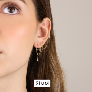 Puede incluir: Pendiente de oreja dorado con m&uacute;ltiples cadenas que cuelgan. La cadena mide 21 mm de largo.
